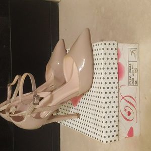 Patent leather heels by DELICIOUS with ankle straps.